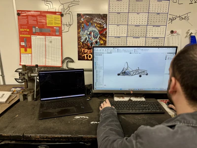 CAD design work at a computer in an engineering environment