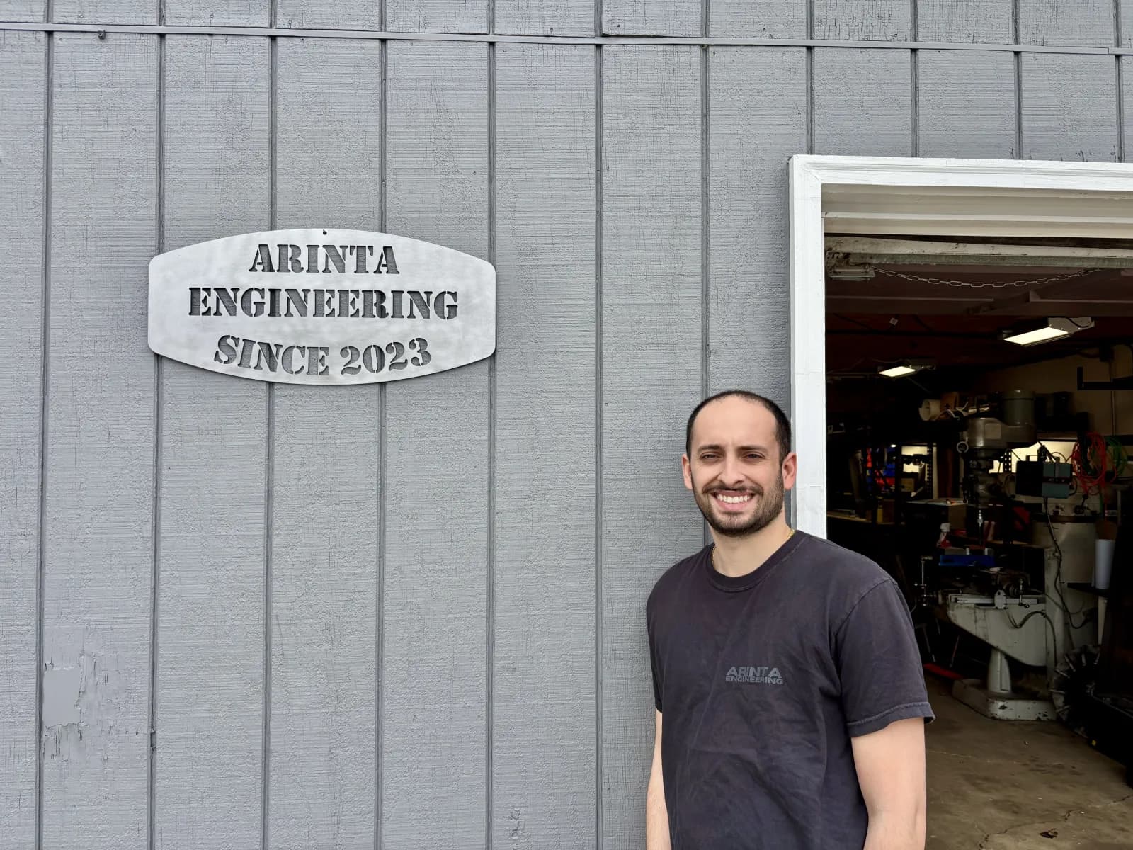 Nathan Arinta in front of the Arinta Engineering shop in Sturtevant, WI