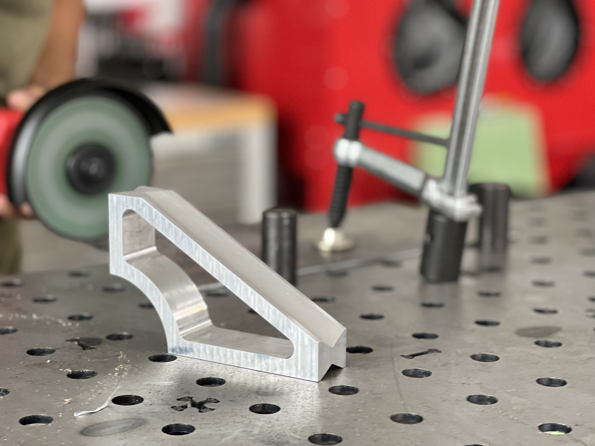 Precision machined aluminum bracket with shallow depth of field